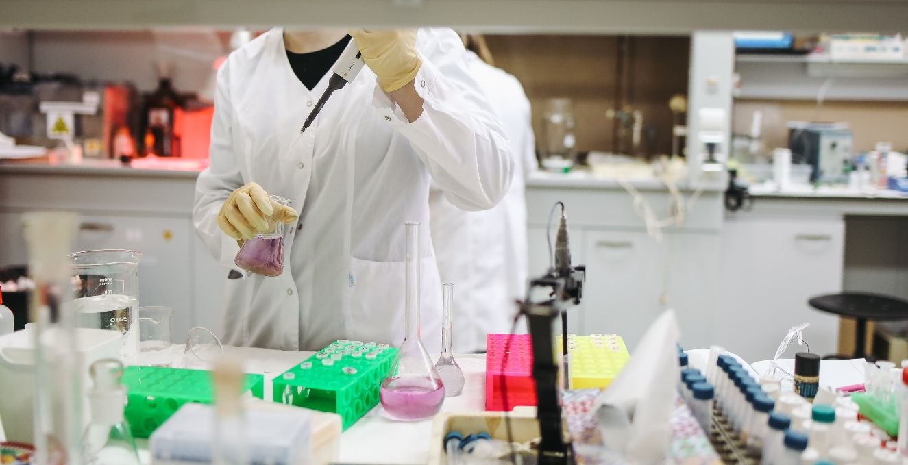 Researchers working with beakers