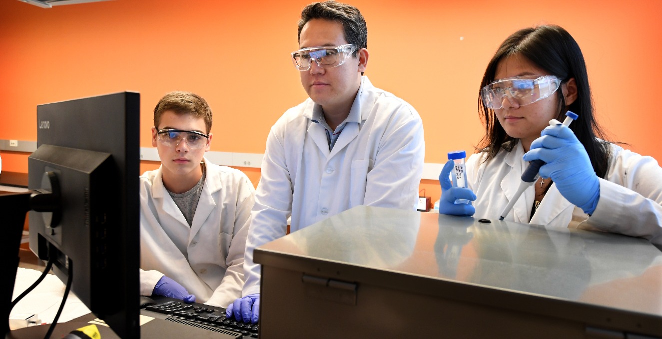 researchers reviewing information on a computer