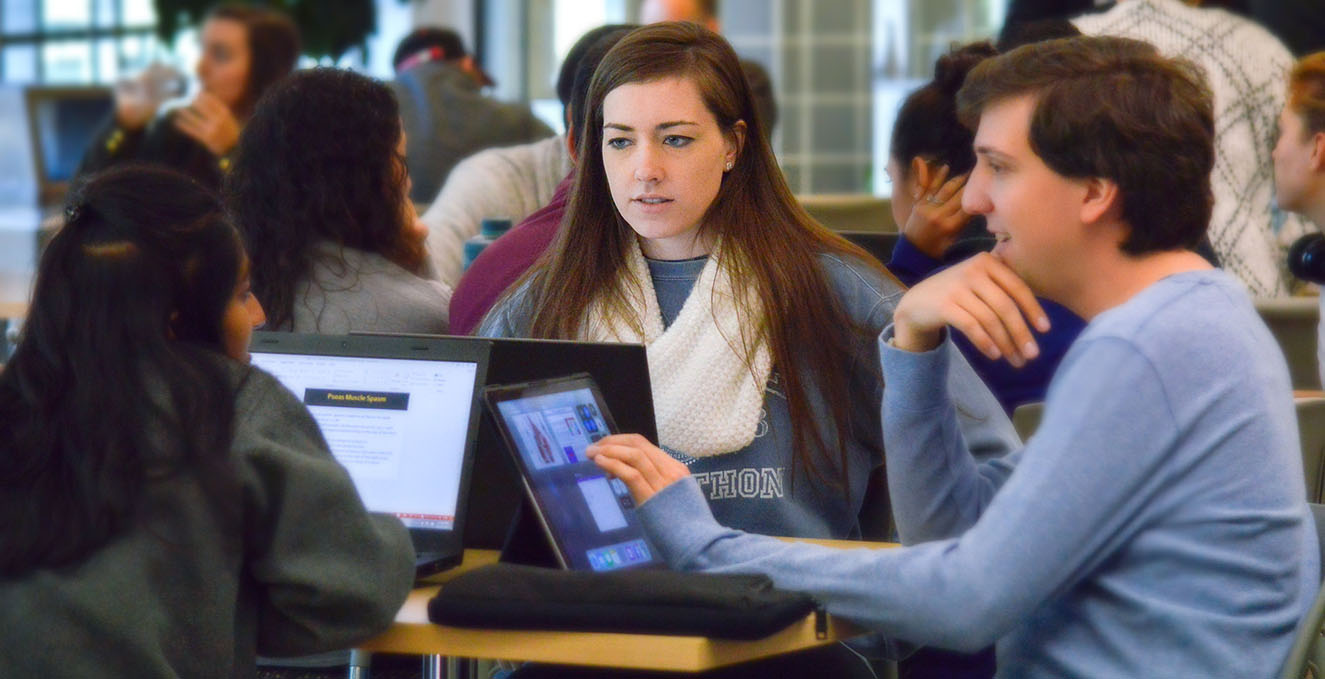 students talking at a table