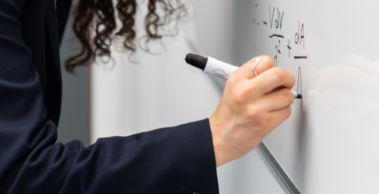 Writing a formula on a white board