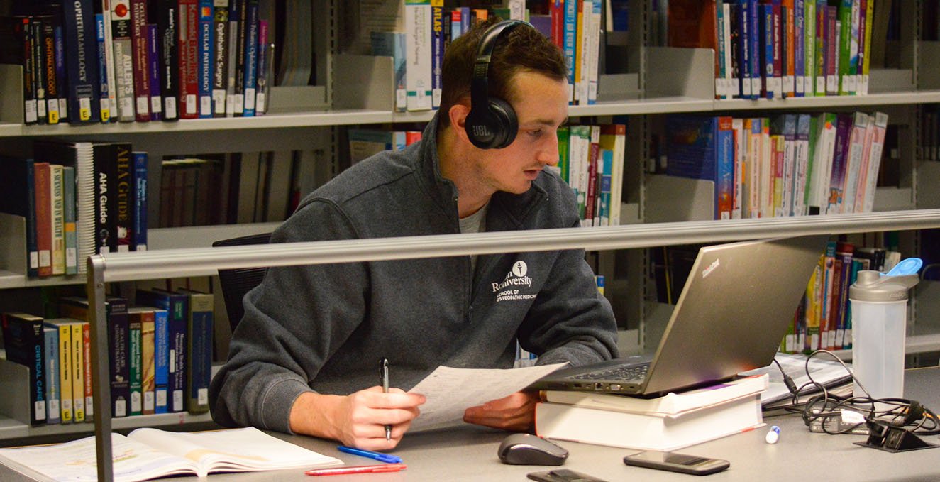student studying in the library